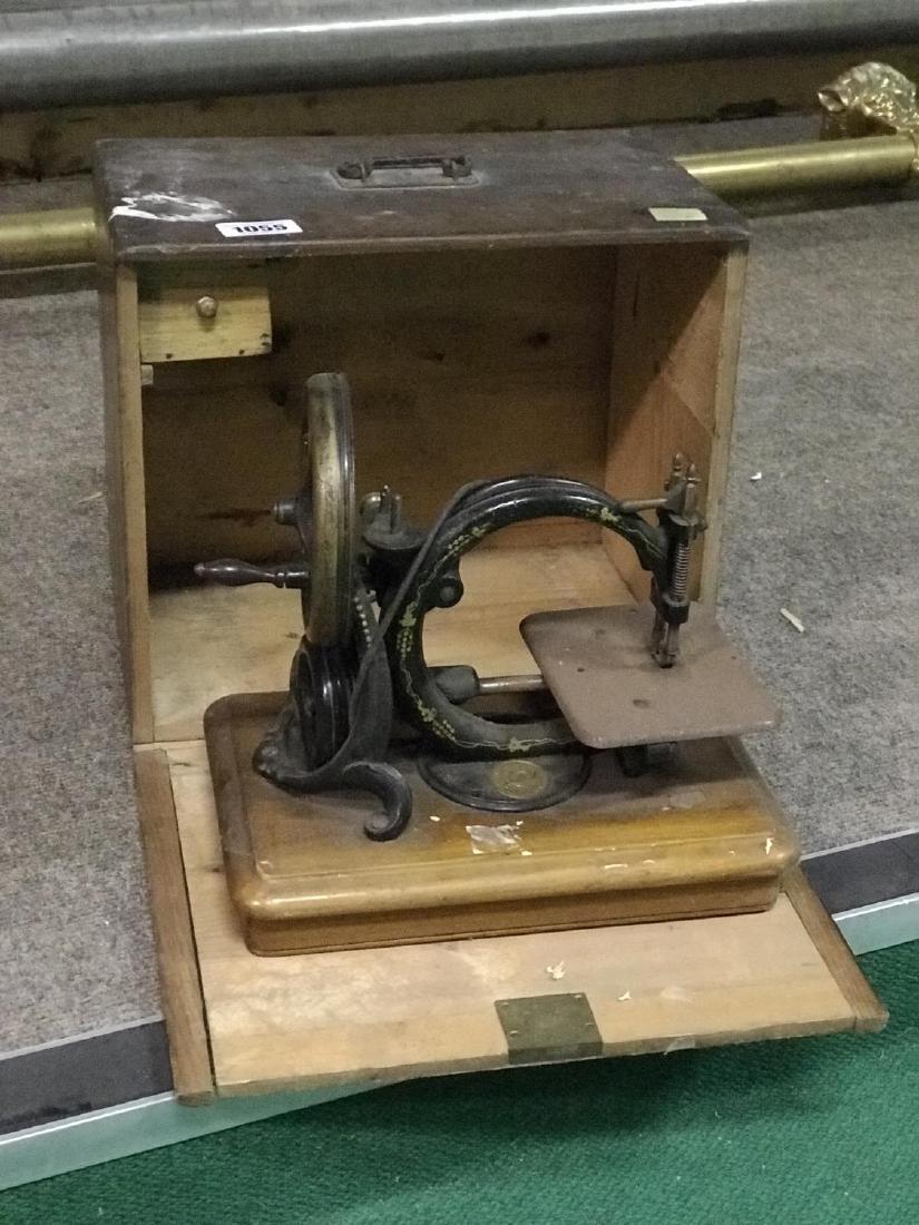 Cased miniature sewing machine: Cased miniature sewing machine