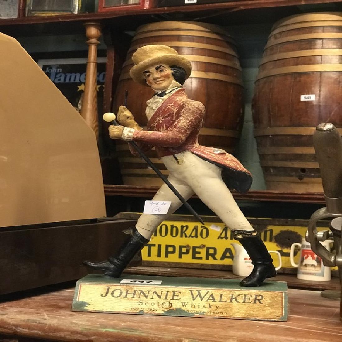 Early 20th C. John Walker Scotch whisky advertising: Early 20th C. John Walker Scotch whisky advertising figure.