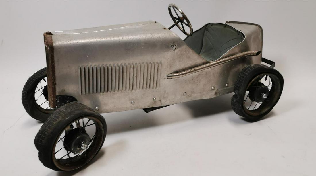 Rare early 20th C. Tri-ang pedal car.: Rare early 20th C. Tri-ang pedal car {58 cm H x 130 cm W x 63 cm D}.
