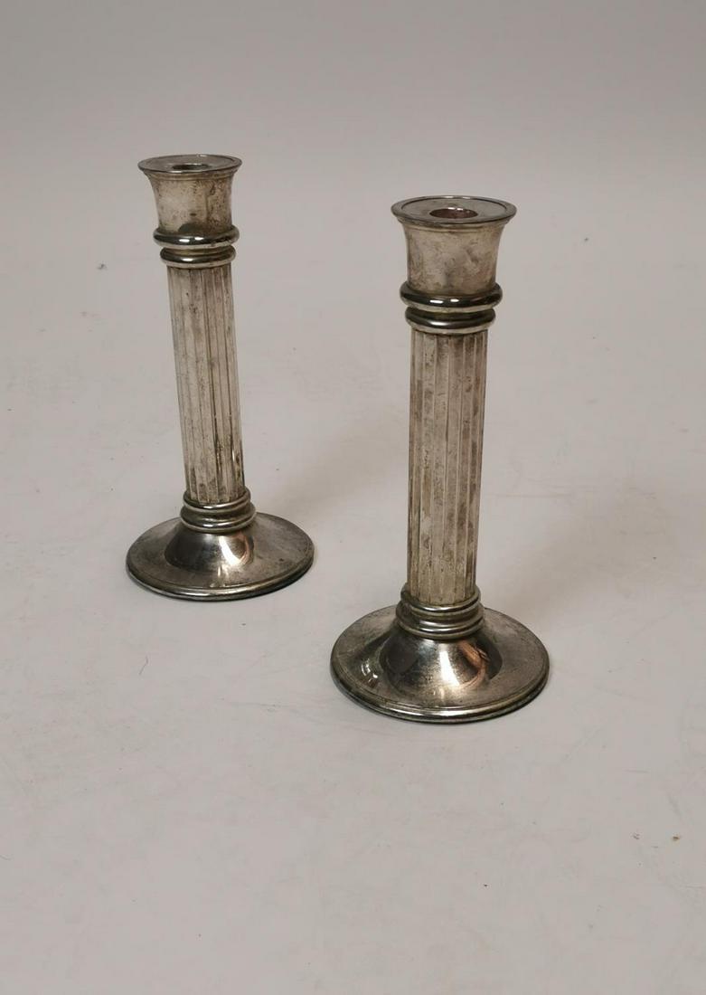 Pair of Edwardian silverplate candlesticks.: Pair of Edwardian silverplate candlesticks in the Georgian manner {25 cm H}.