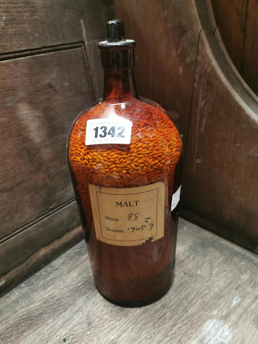 Bottle of Malt for use in the making of whiskey: Bottle of Malt for use in the making of whiskey originally from the Guinness Laboratory. { 34cm H X 12cm Dia. }.
