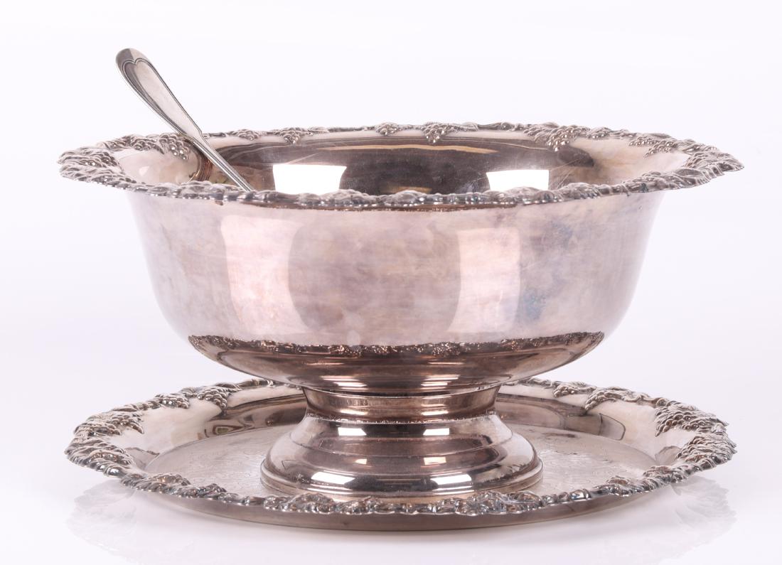 Silver Plate Gorham Punch Bowl, Christofle Ladle: The Gorham bowl with matching stand, "Newport" pattern, together with a Christofle "Chinon" pattern ladle, all marked. Dimensions: The bowl is 17 1/2" x 8 1/4", the stand is 17 1/2" x 1", and the ladl