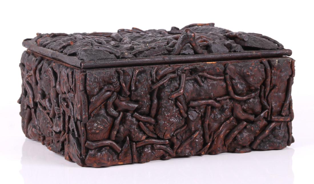 A 19th Century Folk Art Root Decorated Box: Made from a box labeled for the 1873 Vienna Exposition, covered with tree roots, with silk lined interior. Dimensions: 12 1/2" x 10 1/2", 7" at the highest. Provenance: From a Chester County estate.