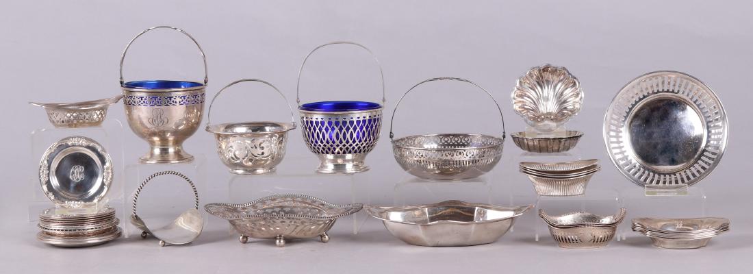 Sterling Silver Trays and Baskets: Comprising: two pierced baskets with bail handles and cobalt glass liners, by Frank M. Whiting, one is monogrammed; a pierced basket with bail handle, by Gorham; a pierced basket with bail handle, by
