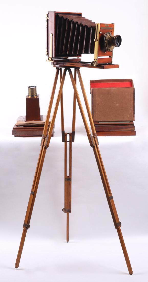 A Late 19th Century Eastman View Camera: With brass plaque that reads, "The Eastman Dry Plate and Film Company, Rochester NY and London. Mahogany with brass Duplex lens, folding stand, extra plates, a James W. Queen & Company rapid rectiline