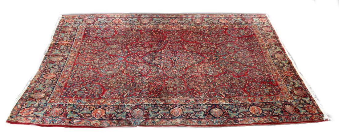 Rug / Carpet, 1920's Painted Sarouk: Mina-khani style with red main ground and midnight blue border, decorated with floral bouquets and sprays. Dimensions: 8' 11" x 11' 8". Provenance: From a local collection.