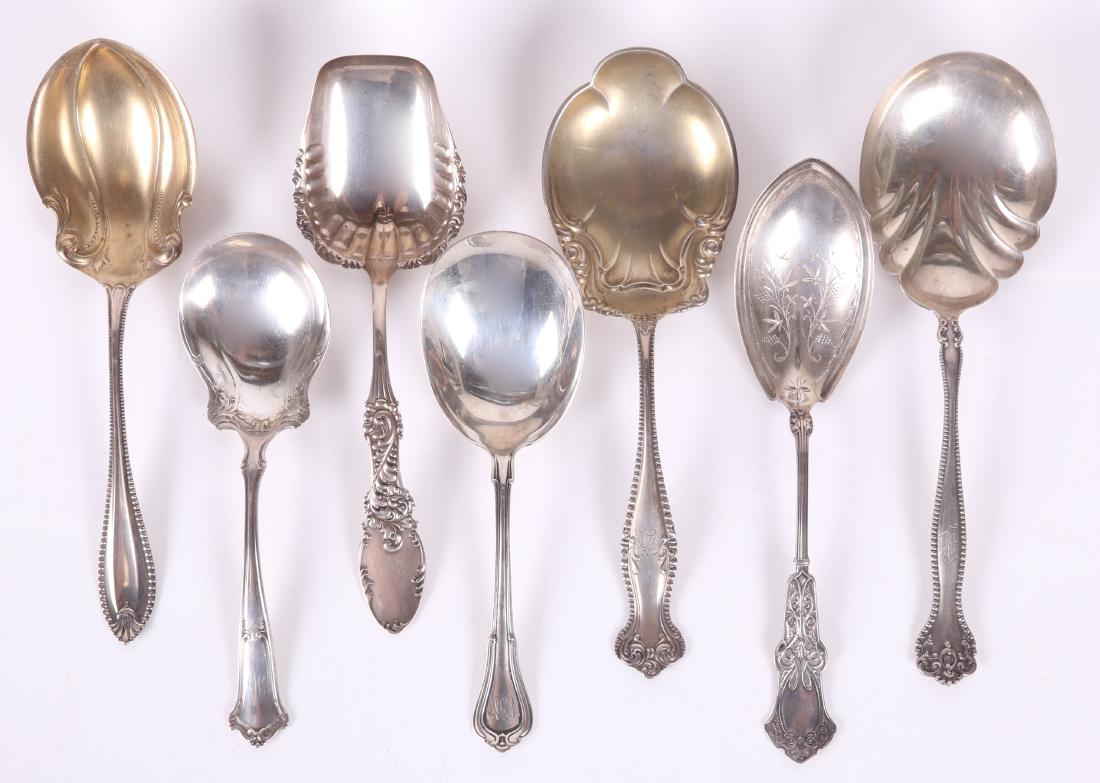 A Group of Sterling Silver Berry Servers: Comprising: Alvin Raleigh, Towle Cordova, Towle Canterbury, Whiting Alhambra, Frank M. Whiting Tyrolean, Gorham Norfolk, and Wallace Saxon. Dimensions: From 7 3/4" to 9 1/4" long, the total approximat