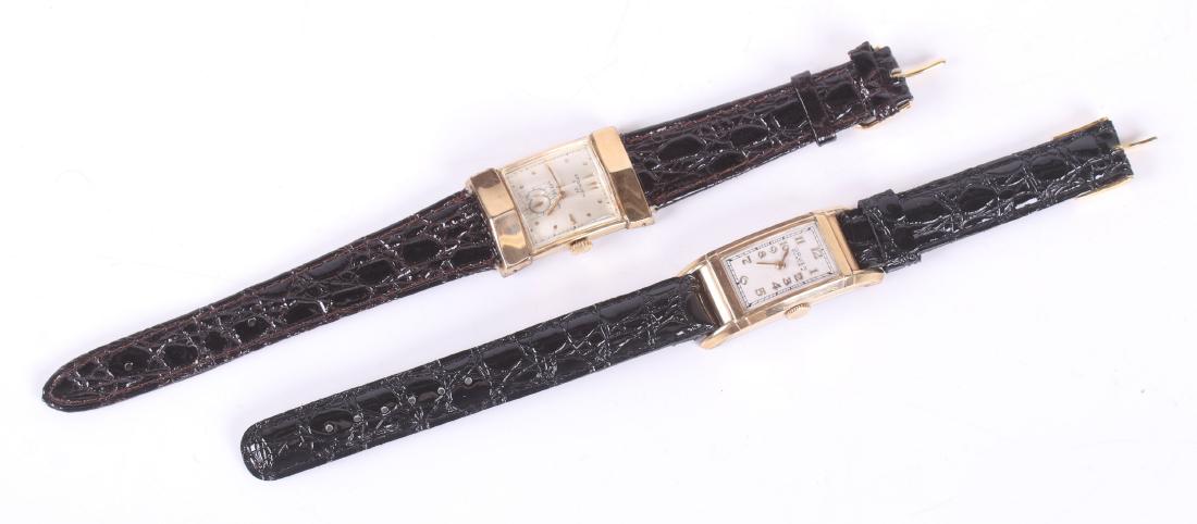 Two Vintage Gruen Wristwatches, Curvex: A Gruen "21" men's wristwatch with a rectangular case and beveled crystal, 21 jewels, serial number C457715, and a Curvex example with a stainless steel back, 15 jewel movement, serial number 502677.