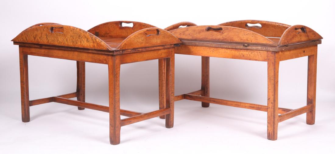 A Pair of Maple Butler's Tray Tables: Early 20th century. Each with straight molded leg, H form stretchers which feature dovetail construction, the tops are paneled and have typical hinged sides with open handles. Dimensions: In the open 