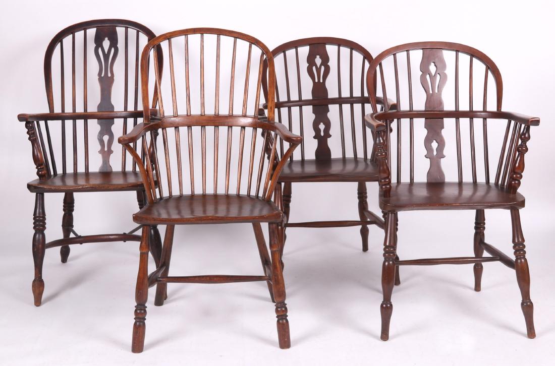 Four English Windsor Armchairs: Three similar examples, 20th century, with turnip feet, ring turned legs, H form stretchers, saddled seats, and central pierced splat. A 19th century single chair with a saddled seat and a back with e