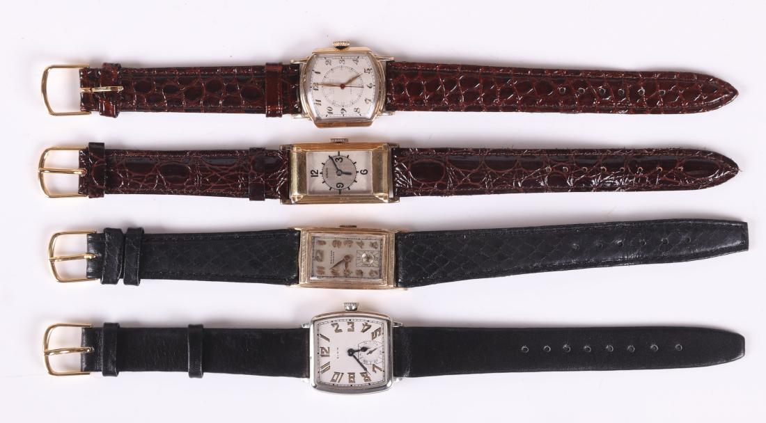 Four Vintage Men's Wristwatches: Comprising: a Waltham "Premiere" with a gold filled case and 17 jewel movement, a Gruen "Veri-Thin" watch with a 17 jewel movement, a Gruen "Guild" example with a gold filled case and a 15 jewel movem