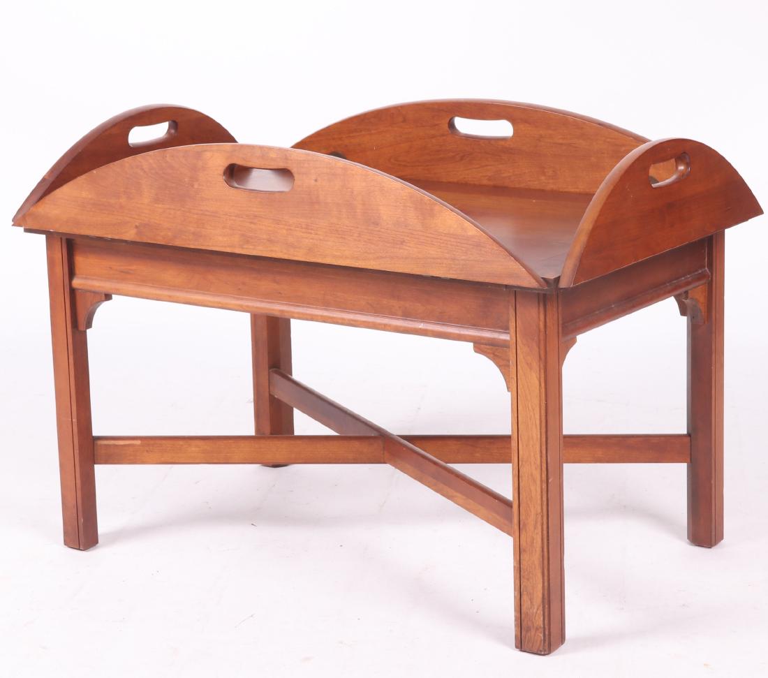 Modern Cherry Butler's Tray Table: Of typical form with hinged sides, square molded legs and X form stretchers. Dimensions: In the open position 42" x 30 1/2", 18" in height. Provenance: From a local collection.