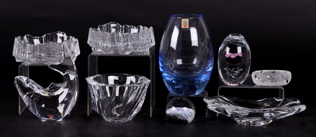 Nine Art Glass Pieces: Lalique, Baccarat, Daum, etc.: Comprising: a Daum paperweight with flowers and bubble decoration; a Caithness "Fleur" paperweight; a Baccarat "Cadix" ashtray; an Orrefors fish figure; an Orrefors "Residence" bowl; a Lalique "Yseult