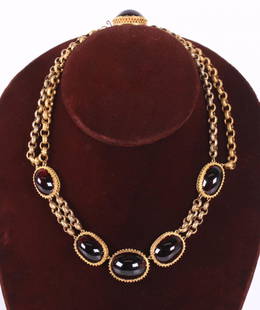 An Amber and 18k Gold Choker Necklace: A chain necklace set with five large amber cabochons, unmarked but tests at 18k. Dimensions: The total approximate gross weight is 41 dwt. The length is 17". Provenance: From a local collection.