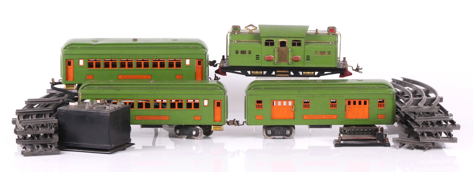 Prewar 318E Lionel Train Set: Comprising: 318E locomotive; 310 mail car; 312 observation car; 309 Pullman car. All are light green, with original boxes. Also includes five straight and eight curved tracks, thirteen connecting ties
