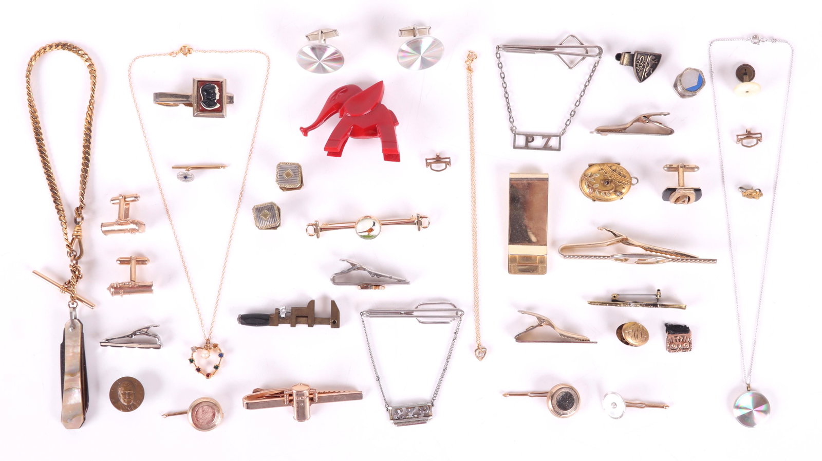 10k and Costume Jewelry, Cufflinks, Etc...: A large group of cufflinks, tie clips, etc... Included in the lot is a group of 10k gold, a locket, a pair of cufflinks, and three clasps. Dimensions: The total approximate gross weight of the 10k gol