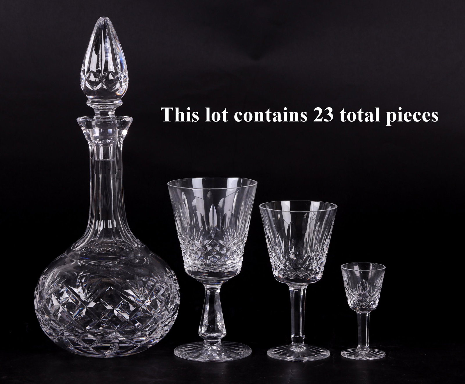 Waterford, "Lismore" Stemware, and a Port Decanter: The stemware comprising: four water goblets, 3 1/2" wide x 6 3/4" tall; twelve claret wine glasses, 3" x 5 3/4"; six cordials, 1 3/4" x 3 1/2". The port decanter appears to be "Killarney" pattern, 5 1