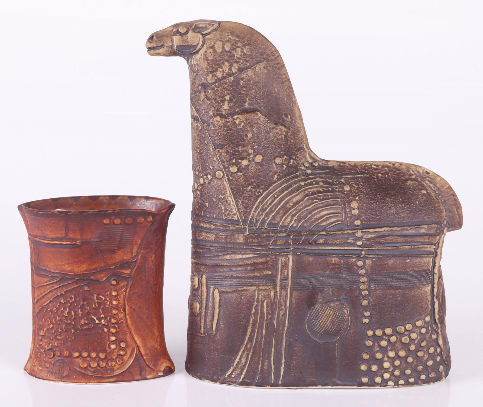 Two Pottery Pieces, Bertil Vallien for Rorstrand: Both from the "Terra" series, an oval hourglass form vase with reddish brown glaze and abstract geometric relief, and an abstract horse sculpture with brown glaze and relief decoration, both marked. D
