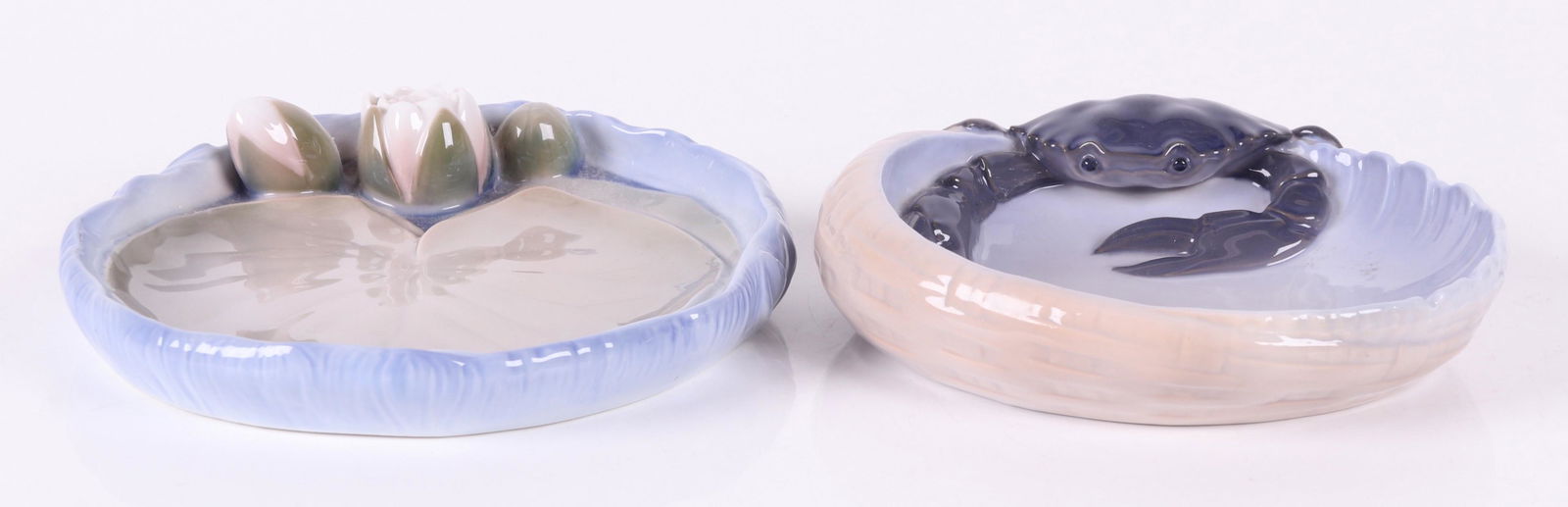 Two Trays, Royal Copenhagen and B&G: A crab decorated example by Royal Copenhagen and a lotus decorated example by B&G. Dimensions: The crab example is 6 1/4" x 6 1/2" and 1 1/2" tall, the lotus example is 7 1/2" x 6 1/2" and 1 1/4" tall