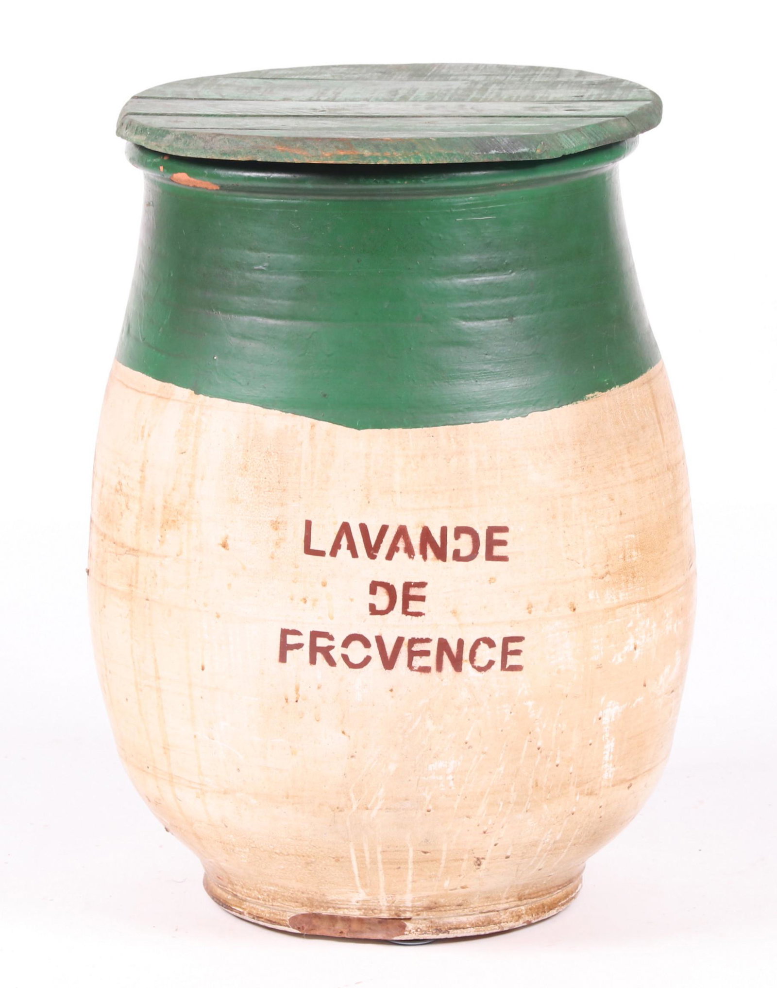 Early 20th Century French Lavender Jar: A large ceramic jar in white and green paint, with stencilled text which reads "Lavande de Provence", with a green painted wooden lid. Dimensions: 16" in diameter, 25" in height. Provenance: From a Ma