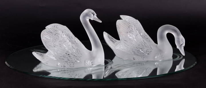 Two Lalique Swans with Mirror Plateau: "Cygne (Tete Droite)" and "Cygne (Tete Penchee)", signed as pictured, the mirror with etched "wake" decoration. Dimensions: The swans are 12 1/2" x 7 ", 9 1/2" in height, and 14" x 8 1/2", 7" in heigh