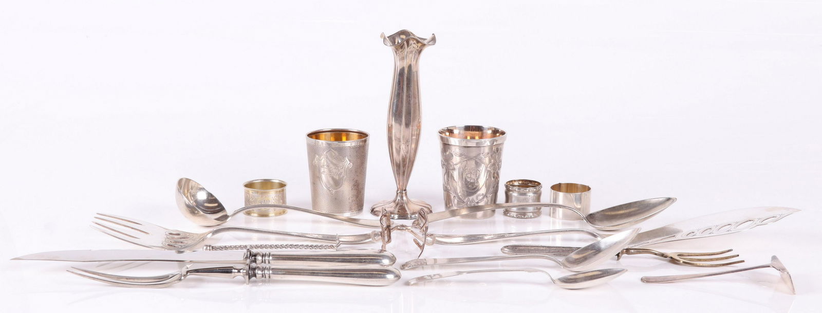 German, Austrian, and Dutch Silver Items: Comprising: a cup with engraved floral decoration (monogrammed) a weighted scalloped bud vase, and a napkin ring, German 800 silver by Wilhelm T. Binder; a cup with diamond pattern decoration and shie
