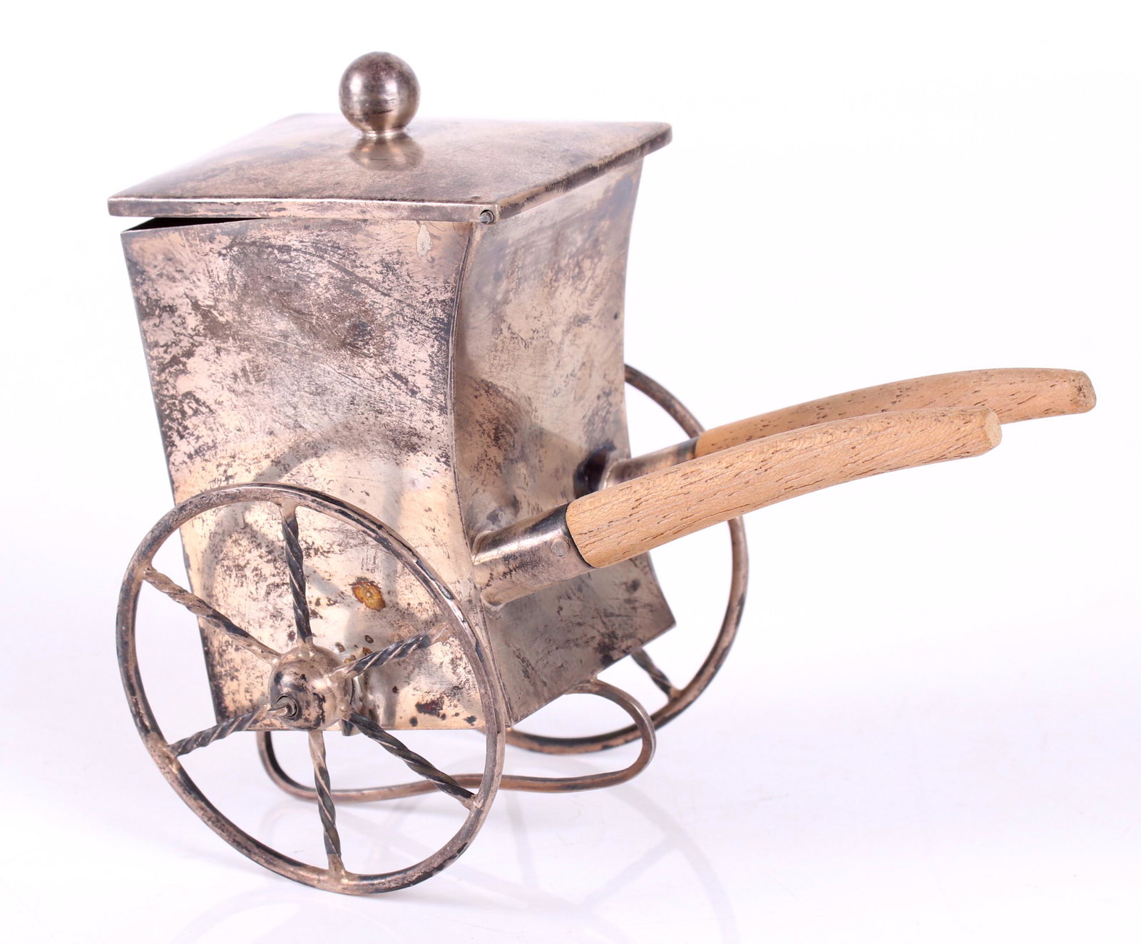 Mexican Sterling Silver Tea Caddy: 20th century, form of a street food cart, with wooden handles, marked, but the mark is partially worn and illegible. Dimensions: 6" x 4", 4 3/4" in height. Provenance: From a local collection.