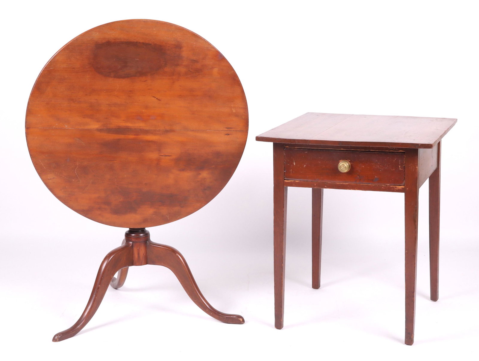 Two Pieces of American Furniture: Tea Table, Stand: A country Hepplewhite one drawer stand with square tapered legs and a dovetailed drawer, made of poplar. A walnut tilt top tea table with snake feet, turned tapered shaft, and a tilting circular top. 