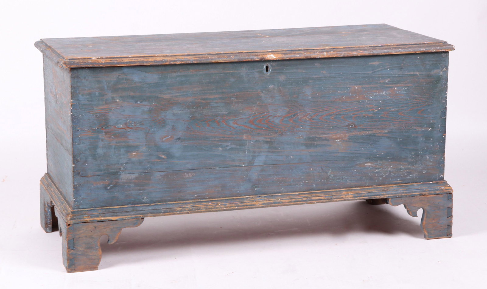 Blue Painted American Blanket Chest: From the first half of the 19th century. Appears to have been scraped down to the original blue at some point. Features replaced dovetailed straight bracket feet, and an interior till. Dimensions: 44 