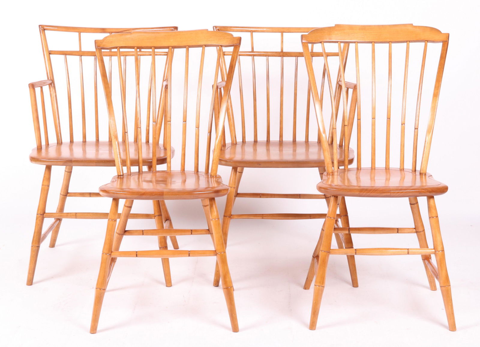 Assembled Set of Four Windsor Chairs: Four high quality reproduction Windsor chairs, two side chairs with seven spindle thumb backs, and two birdcage armchairs. All marked for Curtis Products, Ashburnham, Massachusetts. Dimensions: The si