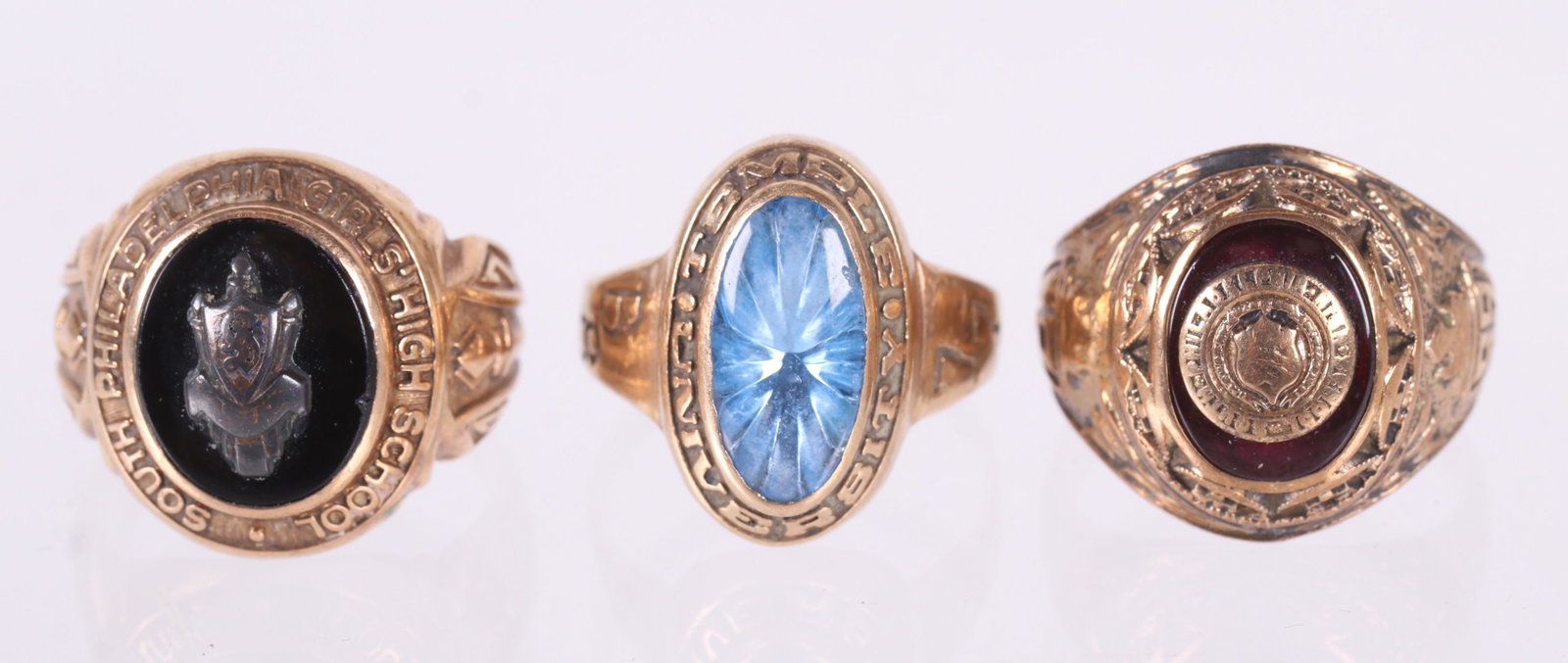 Three Gold Class Rings: All 10k and size 6. Set with onyx and enamel. Dimensions: The total approximate gross weight is 14.1 dwt. Provenance: From a Philadelphia estate.