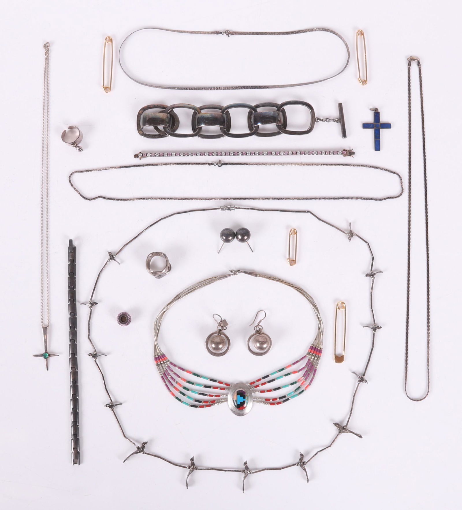 Sterling Jewelry: Georg Jensen, Rey Urban, etc.: Comprising: a mid century modern Finnish sterling cross with central green bead and chain, unidentified maker; a Native American style multicord necklace marked sterling, with various colored beads an