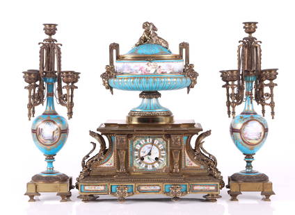 A Sevres Type Bronze Clock with Candelabra: 19th century, a large gilt bronze and porcelain clock with Japy Freres movement with matching candelabra, all three pieces with fine hand painted decoration and "jeweled" ornaments. Dimensions: The cl