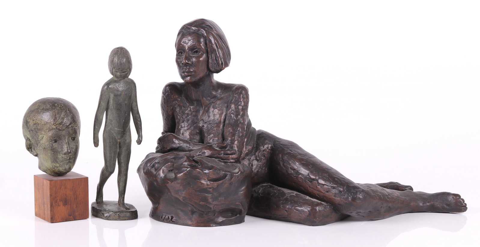 Three Sculptures Including Seymour Remenick: Seymour Remenick (American 1923 - 1999), a small spelter sculpture depicting a little girl, signed on the base, and a head of a little boy mounted to a wooden base, signed on the back of the neck; a s