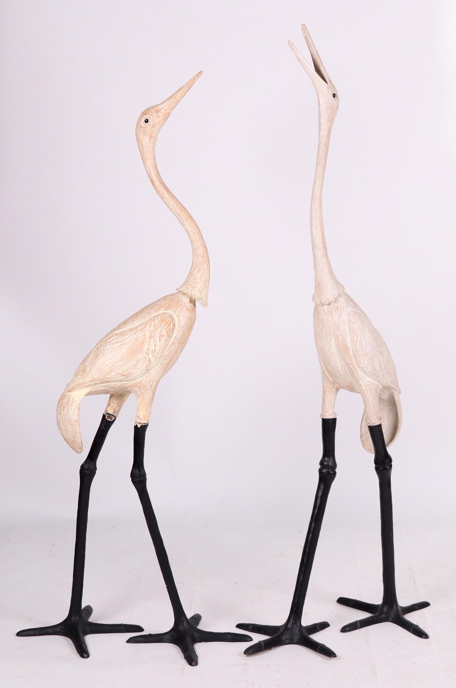 Large Pair of Decorative Storks: Last quarter of the 20th century. Resin, with a wood like surface, each made in four parts. Dimensions: Each is approximately 28" x 22", the heights are 63" and 69". Provenance: From a local collectio