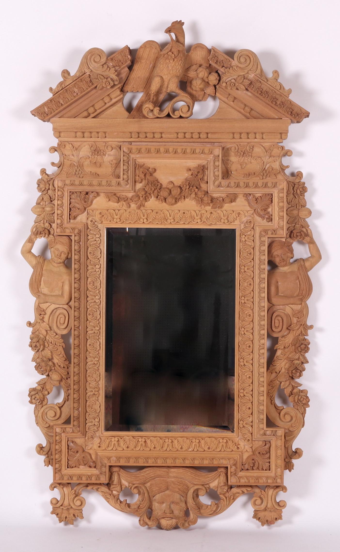Large Baroque Style Carved Wooden Mirror: A 20th century hand carved mirror which has never received a finish. The carved elements include figures, scrolls, flowers, swags, various Classical borders, and a prominent bird at the crest. Dimensi