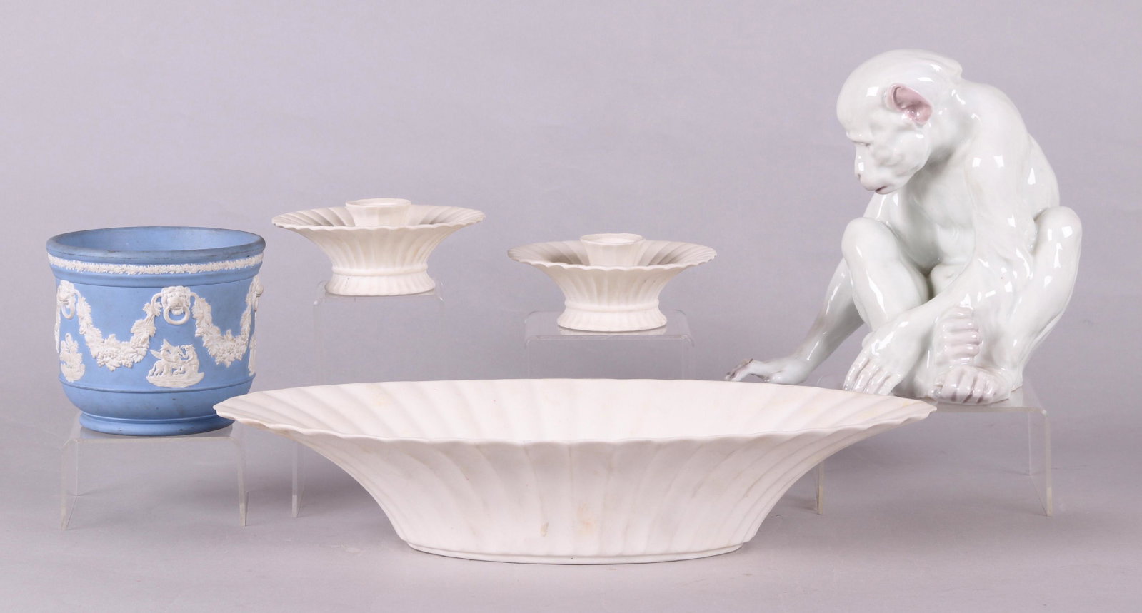 A Group of Ceramics, Boehm, Wedgwood, Etc...: Comprising: a small Wedgwood blue jasper cachepot, a Boehm centerpiece bowl with matching candlesticks, and a majolica monkey in a white glaze. Dimensions: From 5" in diameter to 15 1/2" x 8", the hei