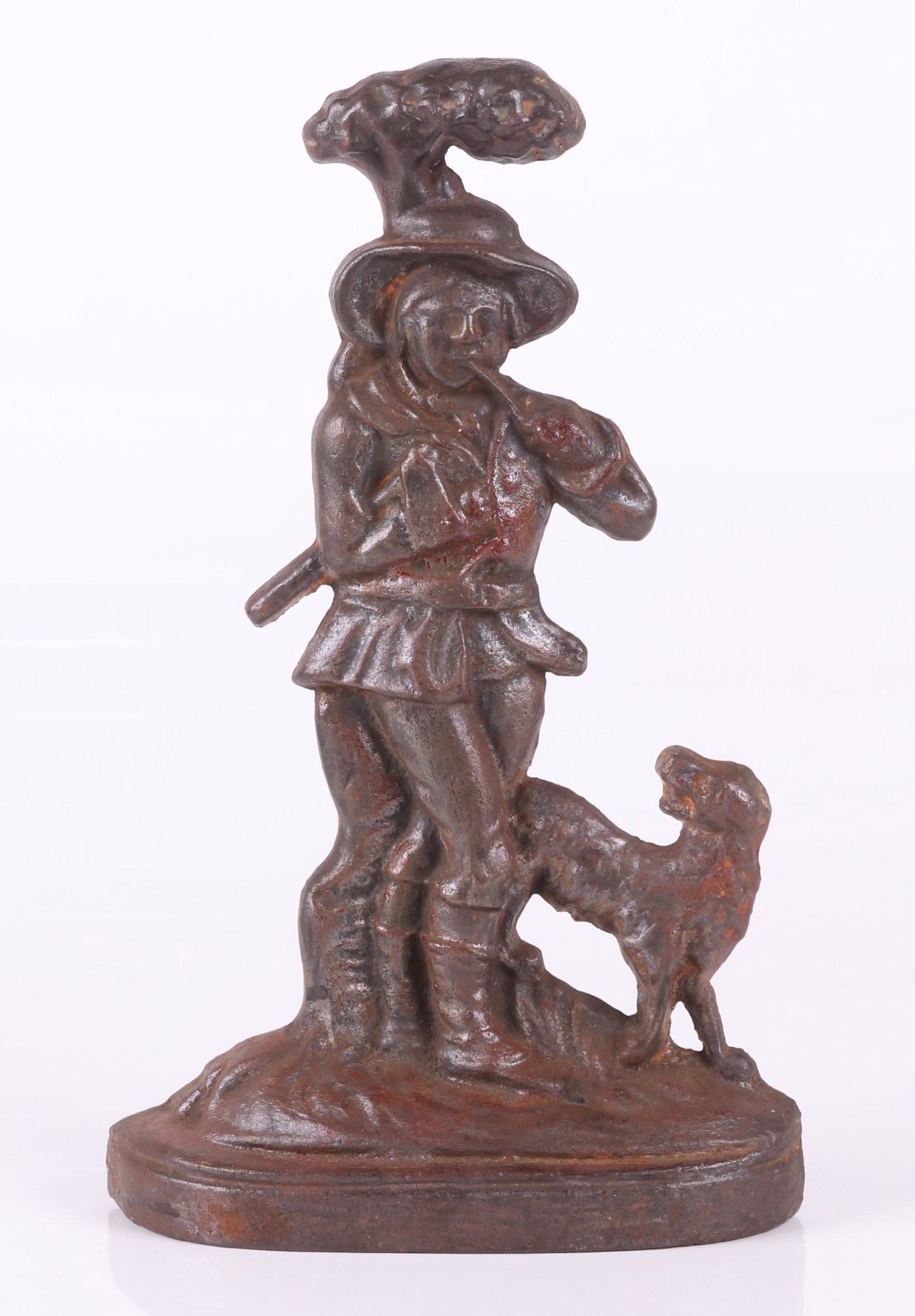 Cast Iron Door Stop, Hunter and Dog: Circa 1920, unpainted. Dimensions: 9 1/4" x 2 1/2" x 15 1/4".