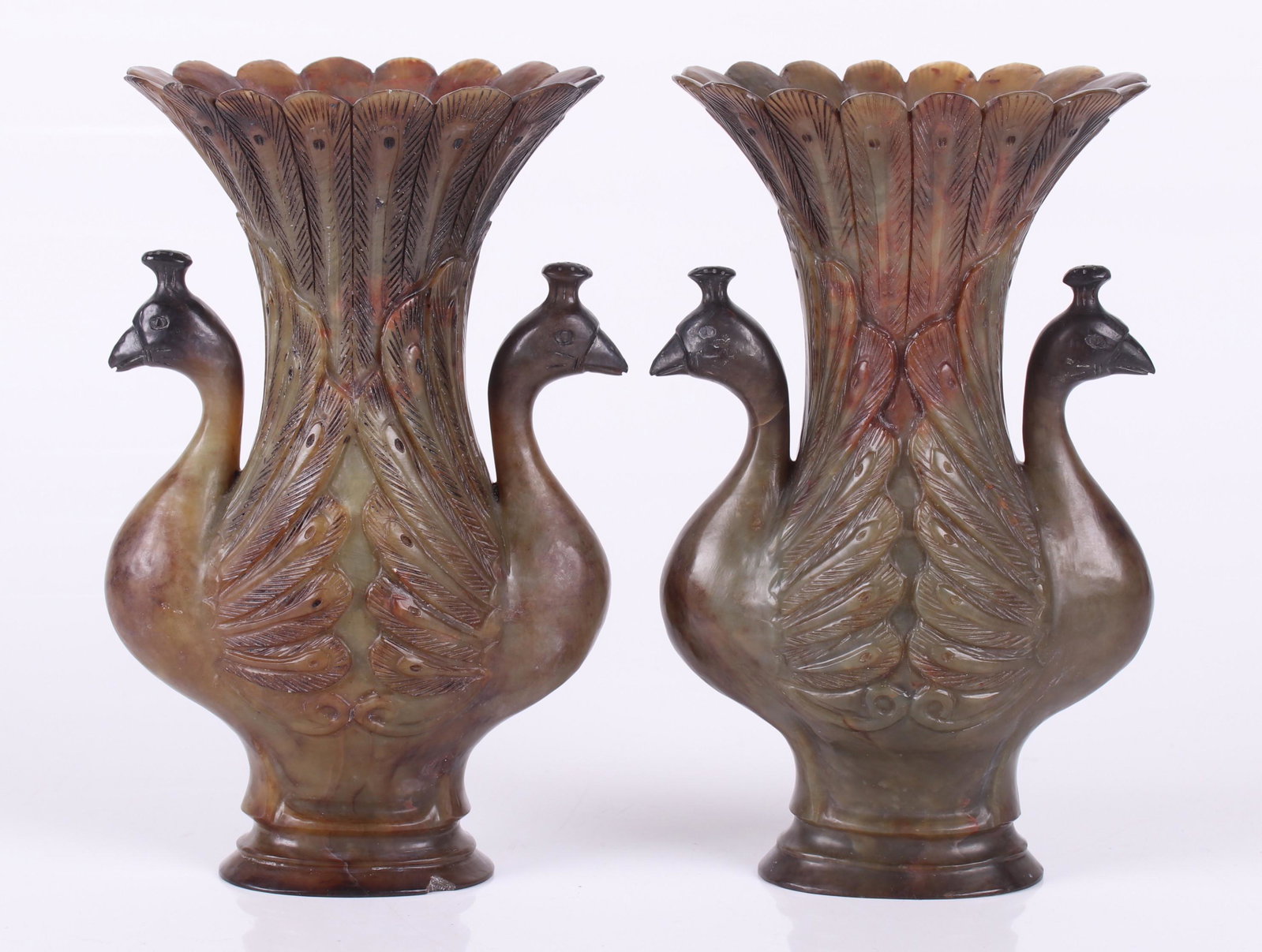 Pair of Chinese Carved Stone Vases, Peacock: A pair of 20th century peacock decorated vases in soapstone. Dimensions: Each is 5" x 3" and 7 1/2" tall. Provenance: From a local collection.