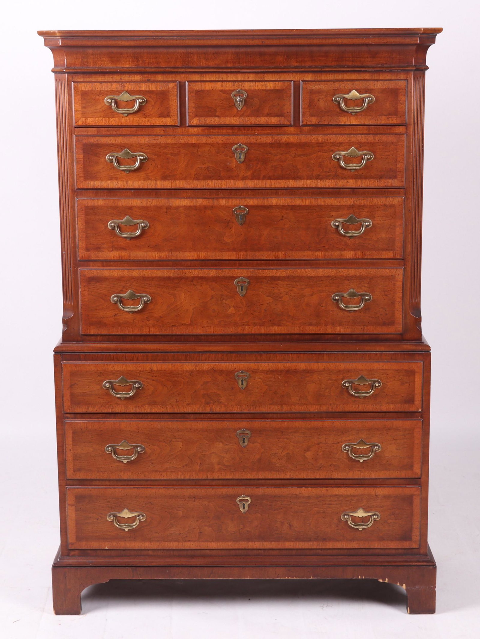 Georgian Style Chest on Chest by Henredon: Mahogany veneer with nine drawers, straight bracket feet, fluted corner columns, and a molded cornice. From the Folio 4 collection. Dimensions: 40" x 19" x 60" tall. Provenance: From a local collectio