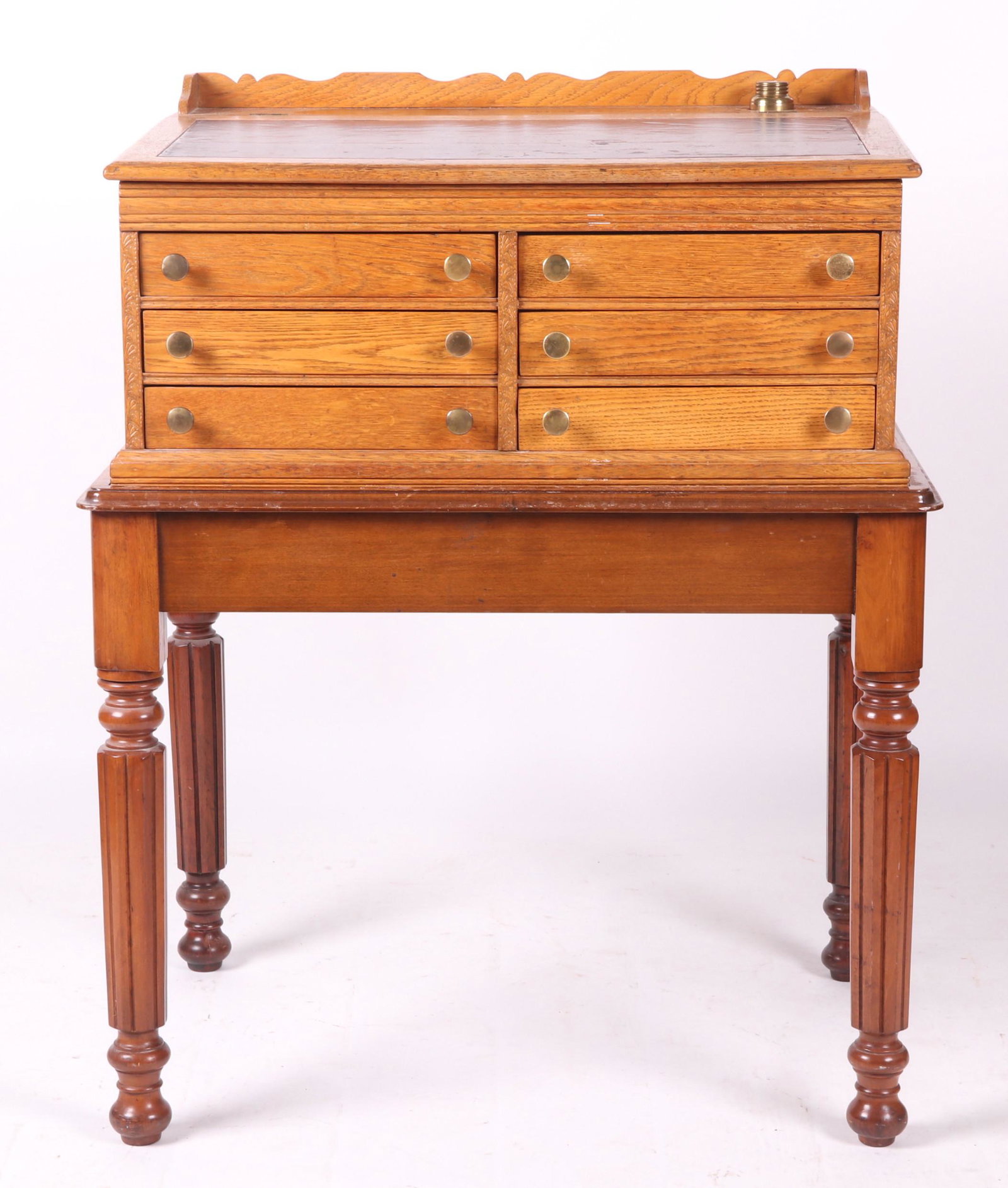 J. & P. Coates Spool Cabinet: Circa 1890. With what appears to be the original walnut base, the cabinet is oak, features six drawers, paneled sides, a slanted writing surface which opens to reveal storage space, a brass inkwell, a