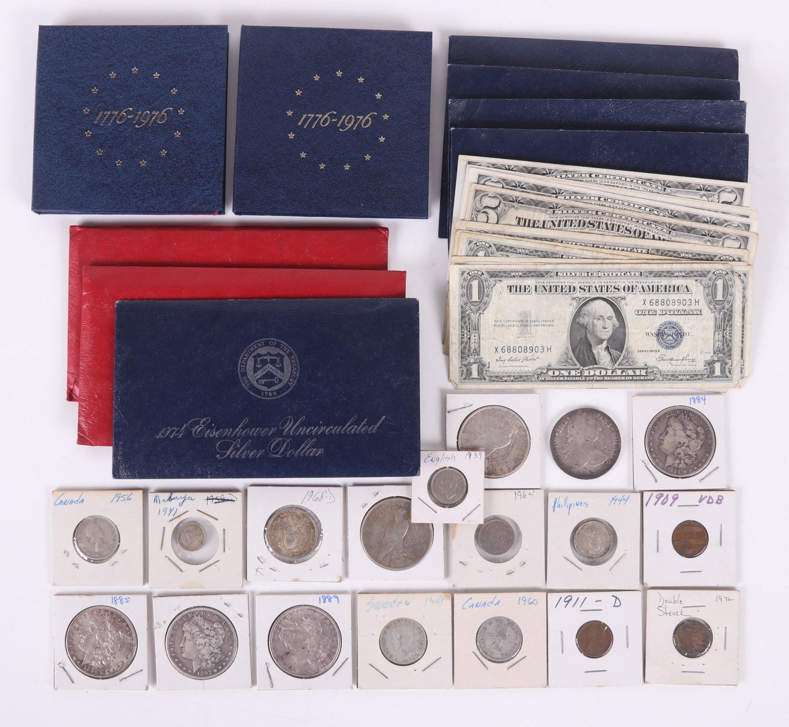 Currency Including Silver Dollars, Proofs, 1790 Real: Comprising: Morgan silver dollars, 1884, 1885, 1892-S, 1889; Peace silver dollars, 1922, 1924; uncirculated Blue Ike silver dollars, 1974 (5); Bicentennial silver uncirculated sets (2), and Bicentenni