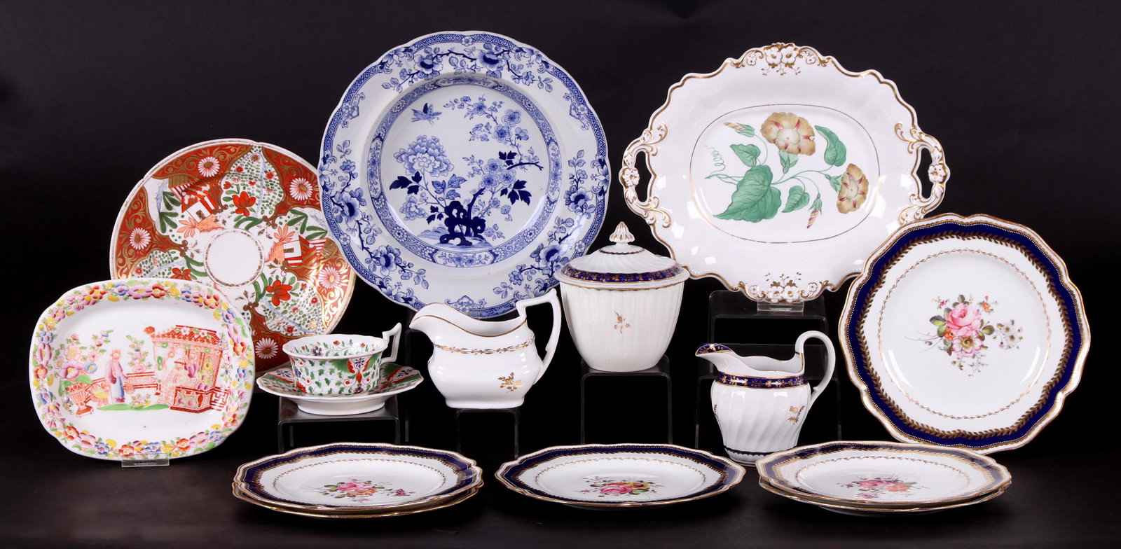 A Group of English Ceramics: Comprising: a ironstone soup bowl with blue floral transfer decoration, a pearlware lobed covered sugar bowl and creamer with blue and gold decoration by Royal Worcester, an early 19th century unmarke