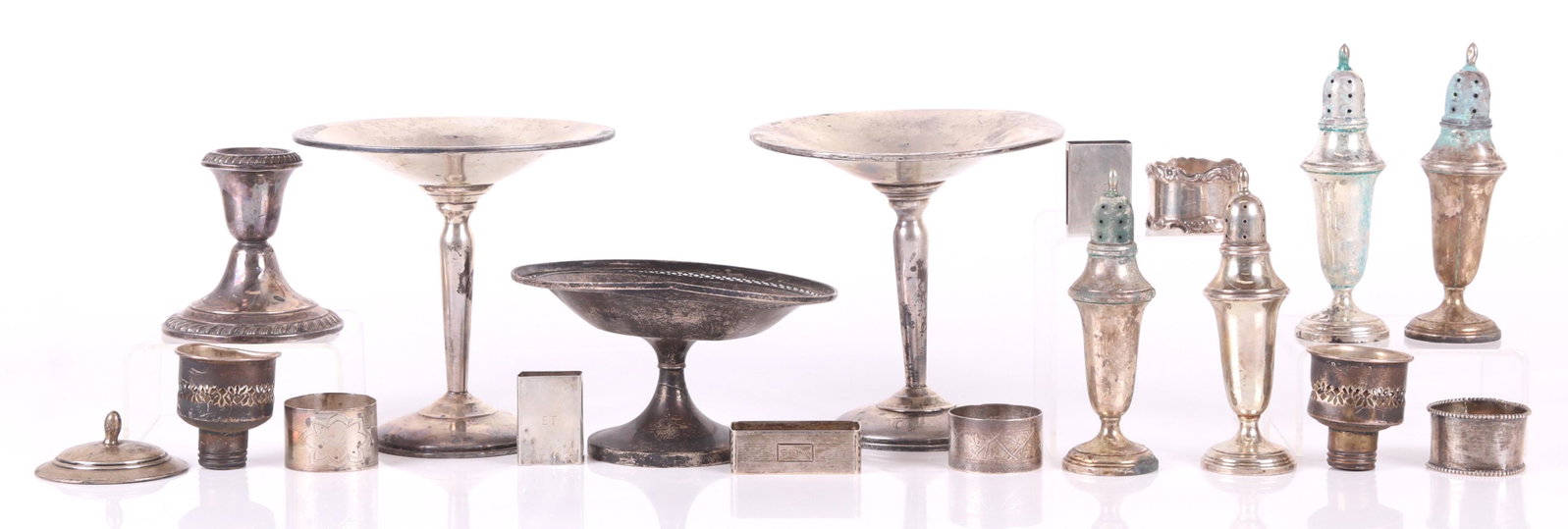 Sterling Silver Hollowware, Compotes, Shakers, etc.: Comprising: a pair of weighted compotes, by Bailey, Banks and Biddle; a weighted compote with pierced rim, by Watson; a weighted candlestick with gadrooning, by Gorham; a set of four shakers, by John 
