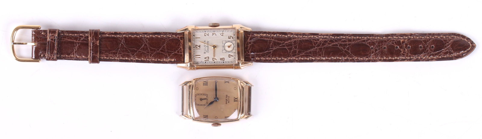 Two Vintage Gold Filled Men's Wristwatches: A Bulova Excellency example with a 10k gold filled case and a 21 jewel movement, and an Elgin De Luxe watch with a 10k gold filled case and a 17 jewel movement. Dimensions: The cases measure about 1 1
