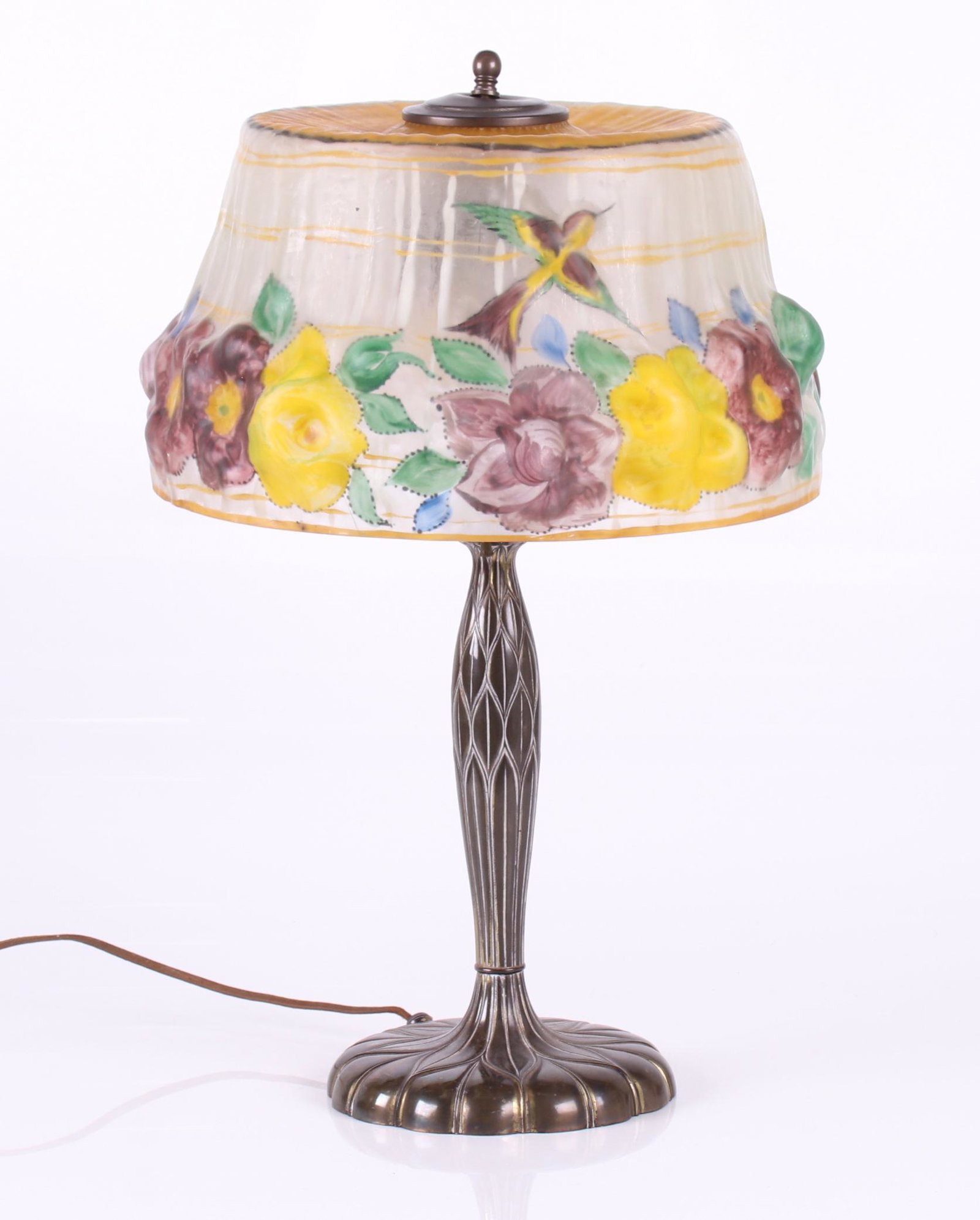 Pairpoint Puffy Lamp: A two light example, with an artichoke pattern brass base, marked C3066, also with original paper label, and a reverse painted "puffy" molded glass Stratford style shade which is decorated with flower