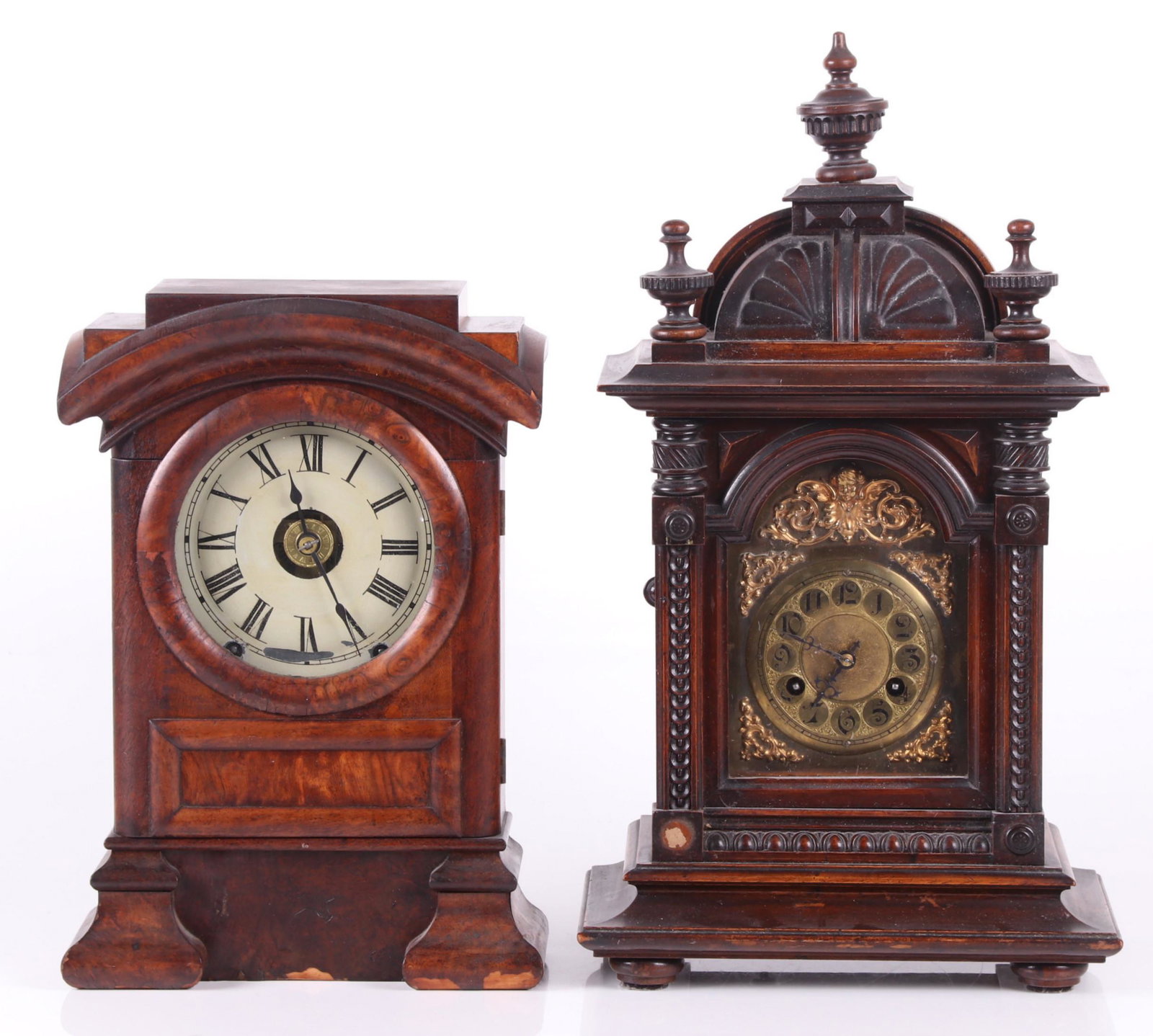Two Mantel Clocks, Junghans and Seth Thomas: A late 19th century Junghans shelf clock with a brass dial, chiming eight day movement and well carved walnut case, the mid 19th century Seth Thomas example features burled veneer, painted tin dial an