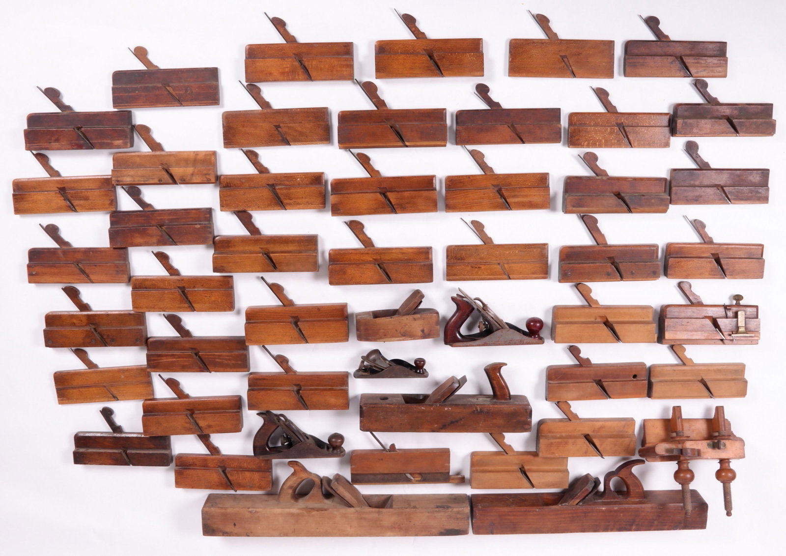 Large Group of English and American Hand Planes: Over 40 planes, various sizes, wood and metal, makers including Atkin and Sons, Moseley and Son, J. Gibson, T. J. McMaster and Co., Lourie, and others, 19th and 20th centuries, all with blades. Dimens
