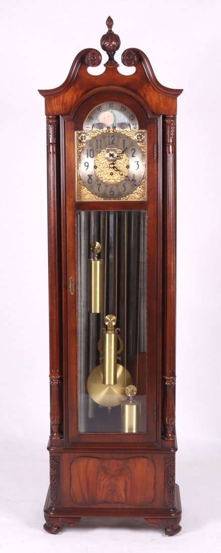 Nine Tube Tall Case Clock by Herschede: Mid 20th century, with a mahogany Chippendale style case, eight day movement with moon phase, chimes are Whittington, Westminster and Canterbury. Dimensions: 23 1/2" x 14", the height is 80". Provenan