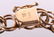 A 14k Gold Charm Bracelet - 6